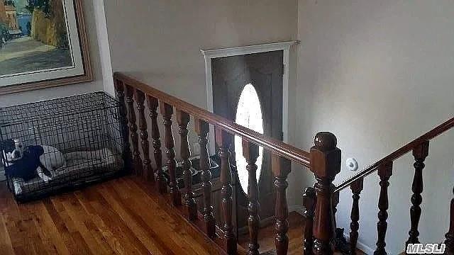 569 Peninsula Blvd, Cedarhurst, NY 11516 - stairs with wood finished floors
