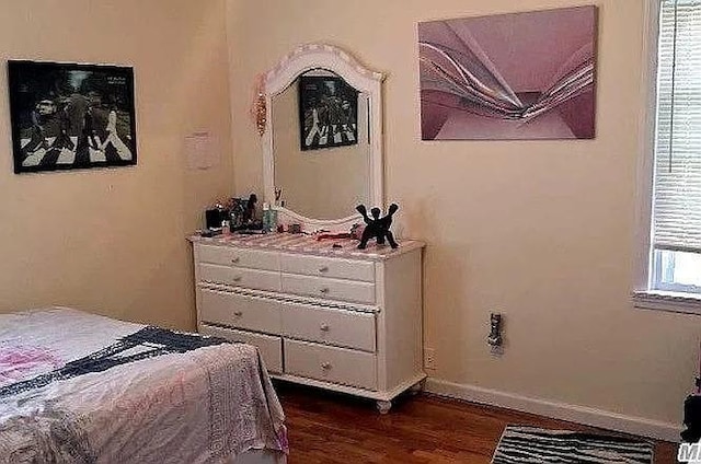 569 Peninsula Blvd, Cedarhurst, NY 11516 - bedroom with dark wood finished floors and baseboards