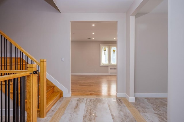 15 Old Nyack Tpke Unit 201, Monsey, NY 10952 - staircase with radiator heating unit, recessed lighting, wood finished floors, and baseboards