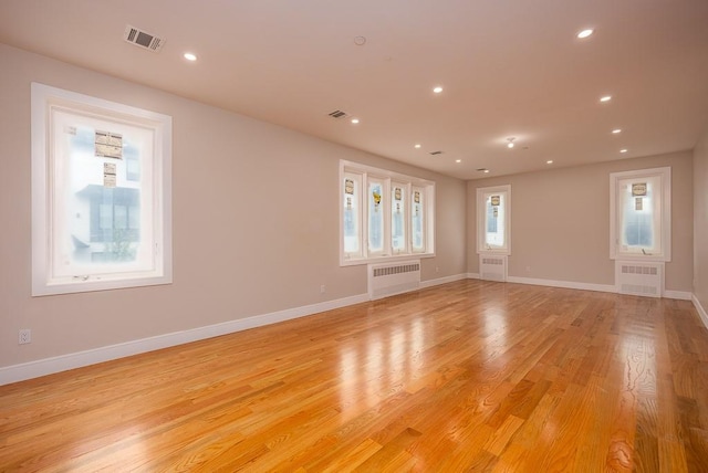 15 Old Nyack Tpke Unit 201, Monsey, NY 10952 - empty room featuring radiator, light wood finished floors, baseboards, and recessed lighting