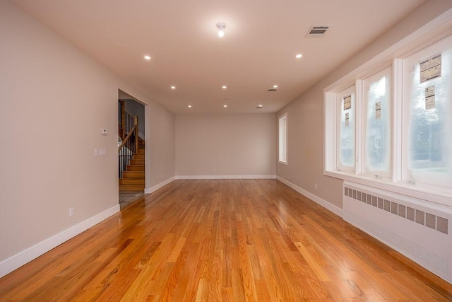 15 Old Nyack Tpke Unit 201, Monsey, NY 10952 - spare room with radiator, light wood-style floors, stairs, baseboards, and recessed lighting