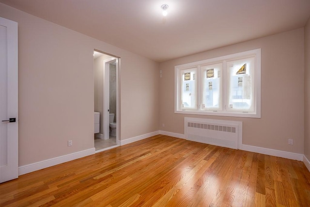 15 Old Nyack Tpke Unit 201, Monsey, NY 10952 - spare room with radiator, baseboards, and light wood-type flooring