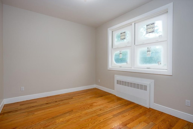 15 Old Nyack Tpke Unit 201, Monsey, NY 10952 - spare room featuring radiator, light wood-style floors, and baseboards