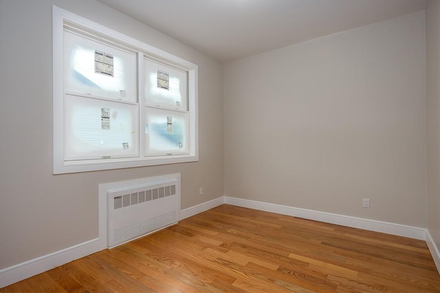 15 Old Nyack Tpke Unit 201, Monsey, NY 10952 - empty room with radiator heating unit, baseboards, and light wood-type flooring