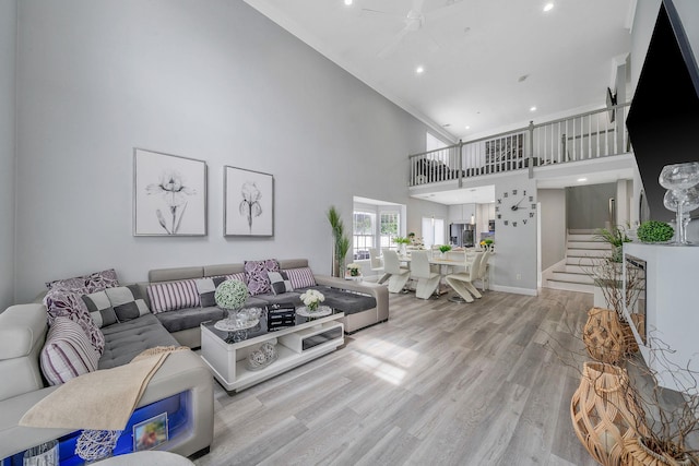 4 Cari Ln, Middle Island, NY 11953 - living area with a towering ceiling, a ceiling fan, light wood-style floors, recessed lighting, and baseboards