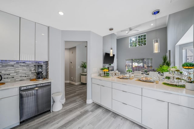 4 Cari Ln, Middle Island, NY 11953 - kitchen featuring dishwasher, ceiling fan, light countertops, backsplash, and decorative light fixtures