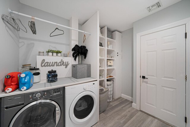 4 Cari Ln, Middle Island, NY 11953 - laundry area with washing machine and dryer, light wood finished floors, and baseboards