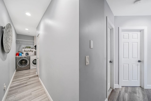4 Cari Ln, Middle Island, NY 11953 - hall with independent washer and dryer, wood finished floors, baseboards, and recessed lighting