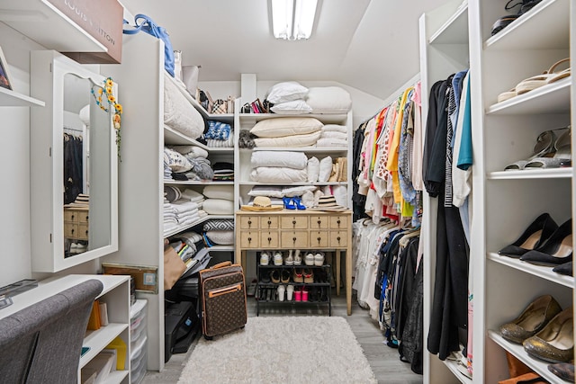 4 Cari Ln, Middle Island, NY 11953 - walk in closet featuring vaulted ceiling and wood finished floors