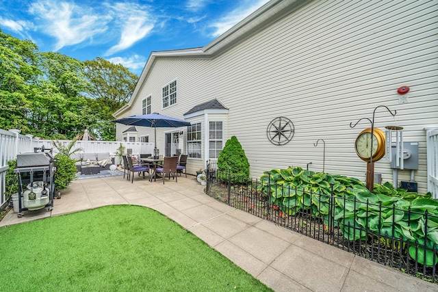 4 Cari Ln, Middle Island, NY 11953 - fenced backyard featuring a patio, grilling area, and an outdoor hangout area
