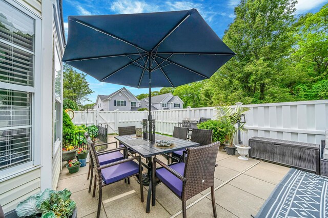 4 Cari Ln, Middle Island, NY 11953 - fenced backyard with a patio and outdoor dining space