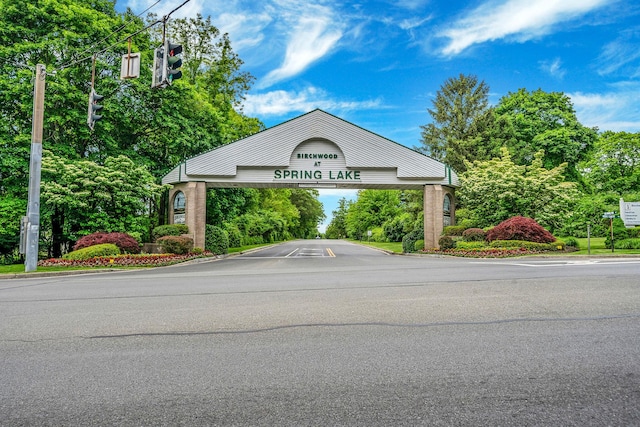 4 Cari Ln, Middle Island, NY 11953 - community sign with uncovered parking and view of scattered trees