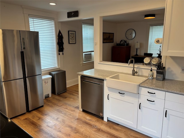 147 Lime Ridge Rd, Poughquag, NY 12570 - kitchen with appliances with stainless steel finishes, light wood-style flooring, white cabinetry, recessed lighting, and cooling unit