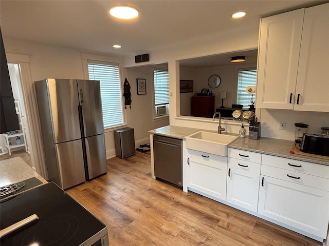 147 Lime Ridge Rd, Poughquag, NY 12570 - kitchen with stainless steel appliances, white cabinets, healthy amount of natural light, light wood-style flooring, and recessed lighting