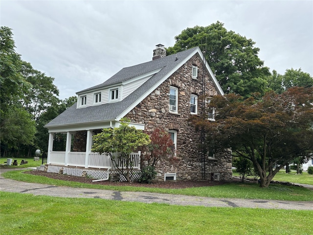 147 Lime Ridge Rd, Poughquag, NY 12570 - view of front of property featuring stone siding, a front yard, covered porch, and a shingled roof