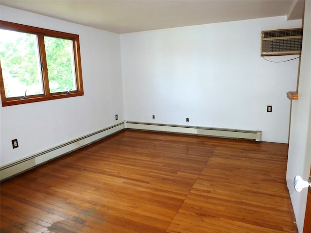 4010 Heywood Rd, Seaford, NY 11783 - empty room featuring wood-type flooring, a wall mounted air conditioner, and baseboard heating