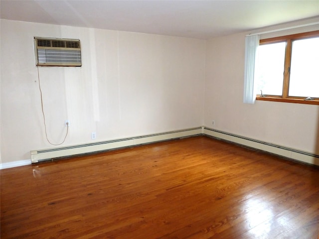 4010 Heywood Rd, Seaford, NY 11783 - unfurnished room with a wall mounted AC and wood finished floors