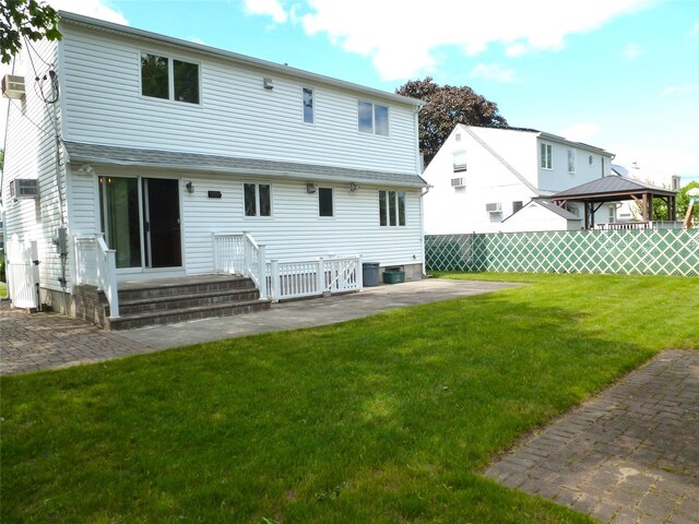 4010 Heywood Rd, Seaford, NY 11783 - rear view of house with a gazebo and a patio area