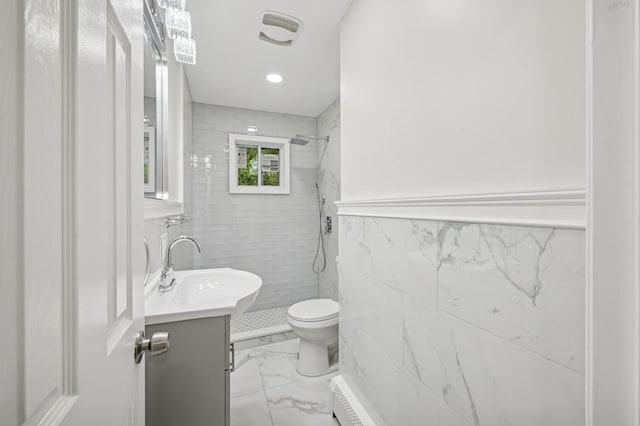 23 Tower St, Huntington Station, NY 11746 - bathroom with tile walls, vanity, a tile shower, toilet, and marble look tile flooring