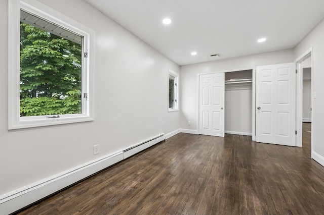 23 Tower St, Huntington Station, NY 11746 - unfurnished bedroom with a baseboard heating unit, wood-type flooring, recessed lighting, baseboards, and a closet