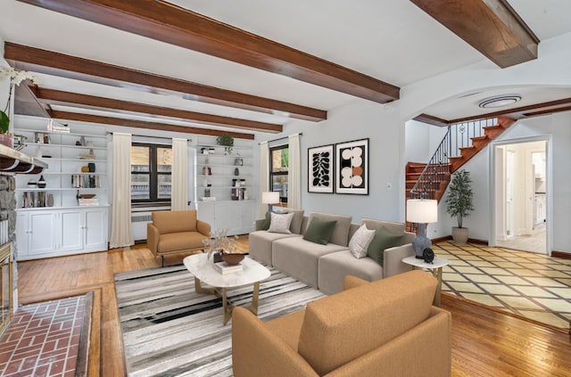164-03 33rd Ave, Flushing, NY 11358 - living area featuring beamed ceiling, wood finished floors, baseboards, stairway, and arched walkways