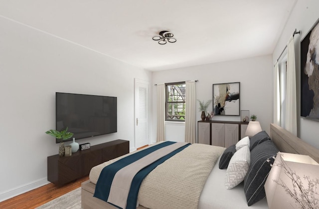 164-03 33rd Ave, Flushing, NY 11358 - bedroom featuring wood finished floors and baseboards
