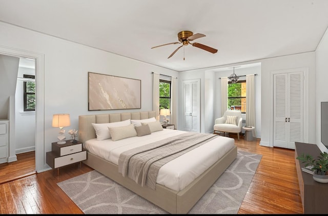 164-03 33rd Ave, Flushing, NY 11358 - bedroom featuring wood-type flooring, baseboards, and ceiling fan