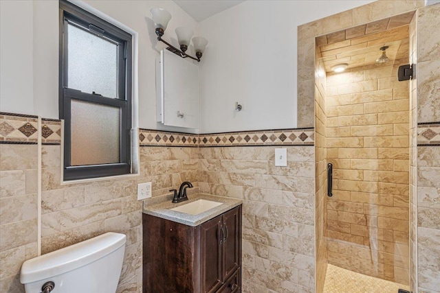 164-03 33rd Ave, Flushing, NY 11358 - bathroom with a shower stall, toilet, tile walls, vanity, and a wainscoted wall