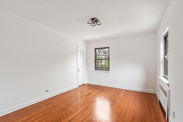 164-03 33rd Ave, Flushing, NY 11358 - empty room featuring wood finished floors and baseboards