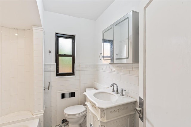 164-03 33rd Ave, Flushing, NY 11358 - full bath with radiator heating unit, toilet, vanity, tile walls, and  shower combination