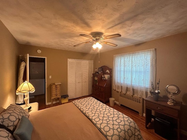 199-58 21st Ave Unit 1-165, Whitestone, NY 11357 - bedroom with radiator, a closet, wood finished floors, a ceiling fan, and a textured ceiling