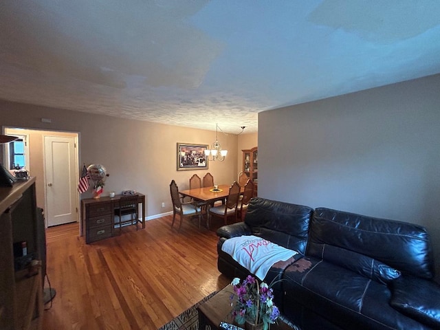 199-58 21st Ave Unit 1-165, Whitestone, NY 11357 - living room with a chandelier, wood finished floors, and baseboards