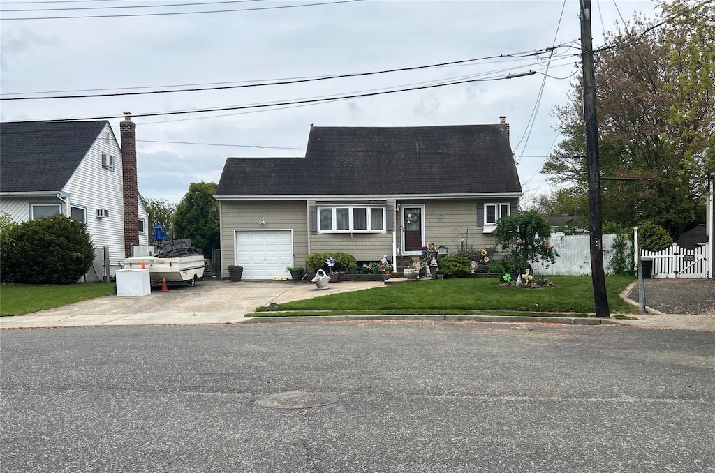 34 Karen St, West Babylon, NY 11704 - cape cod-style house featuring an attached garage, driveway, and a shingled roof