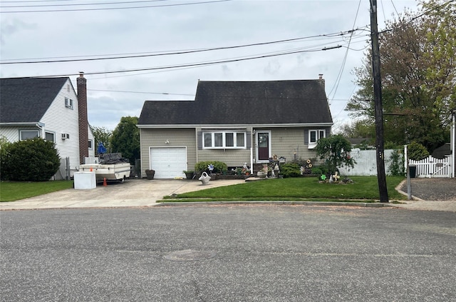34 Karen St, West Babylon, NY 11704 - cape cod-style house featuring an attached garage, driveway, and a shingled roof