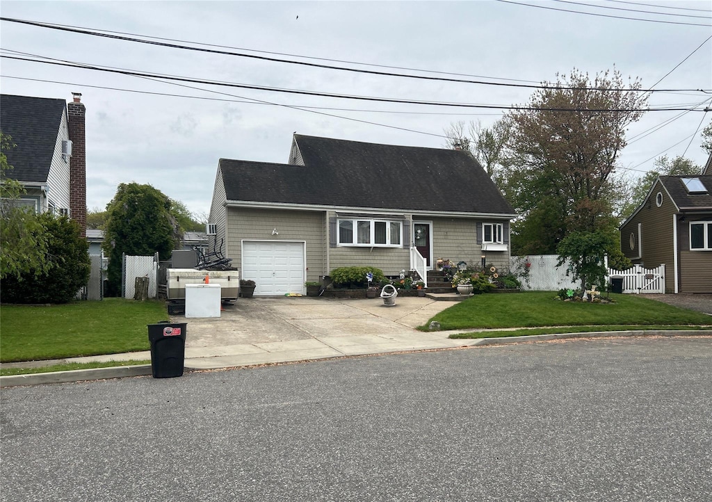 34 Karen St, West Babylon, NY 11704 - cape cod-style house with an attached garage and driveway