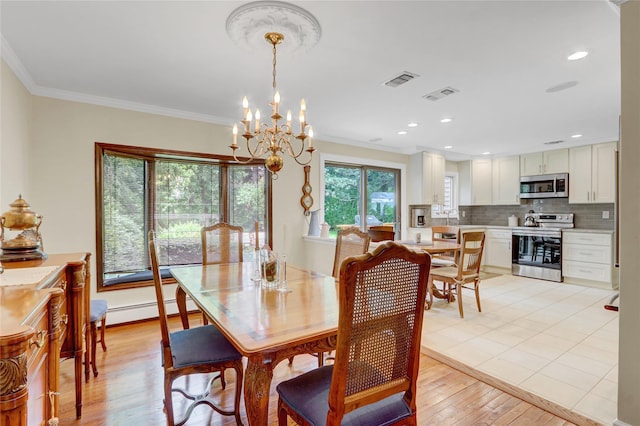 77 Barry Ln, Syosset, NY 11791 - dining area with baseboard heating, a chandelier, crown molding, light wood-style flooring, and recessed lighting