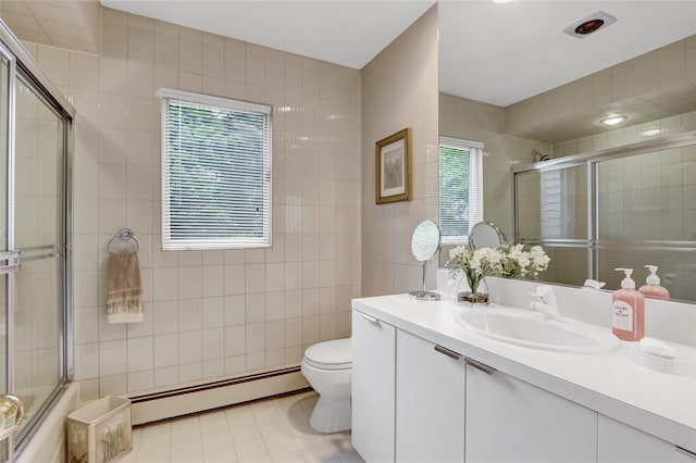 77 Barry Ln, Syosset, NY 11791 - bathroom featuring a baseboard heating unit, tile walls, toilet, a tile shower, and vanity
