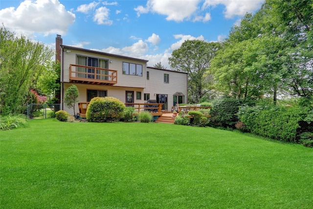 77 Barry Ln, Syosset, NY 11791 - rear view of house with a chimney, a balcony, and a deck