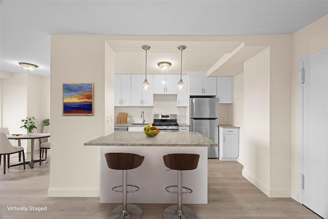 875 Morrison Ave Unit 6E, Bronx, NY 10473 - kitchen with appliances with stainless steel finishes, a sink, baseboards, and light wood-style floors