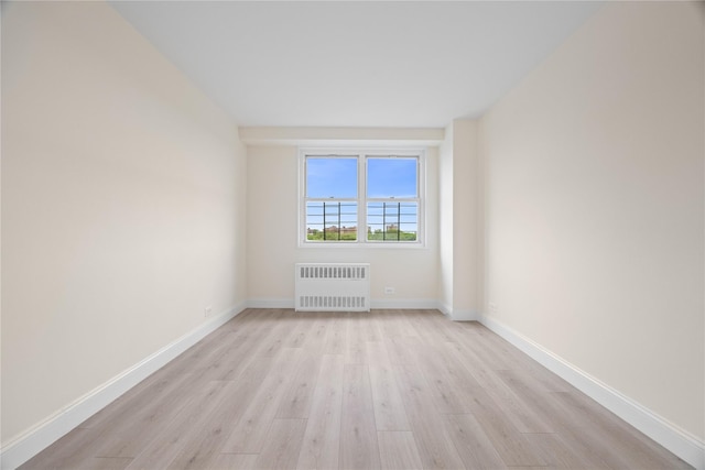 875 Morrison Ave Unit 6E, Bronx, NY 10473 - unfurnished room with radiator heating unit, light wood-style floors, and baseboards