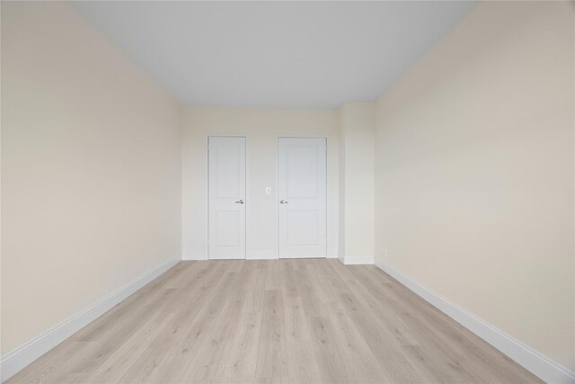 875 Morrison Ave Unit 6E, Bronx, NY 10473 - unfurnished bedroom with light wood-style flooring and baseboards