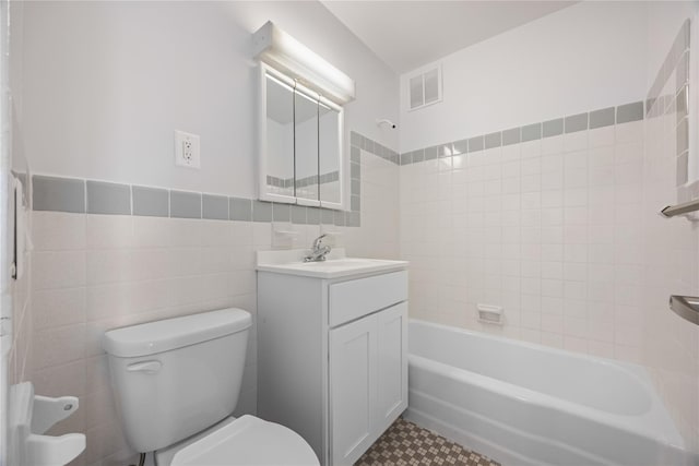 875 Morrison Ave Unit 6E, Bronx, NY 10473 - bathroom featuring toilet, tile walls, vanity, tile patterned floors, and  shower combination