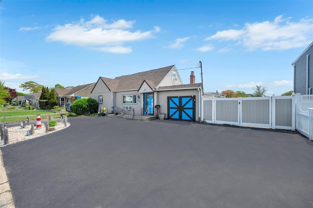 24 Raynor St, West Babylon, NY 11704 - view of front of property with a chimney