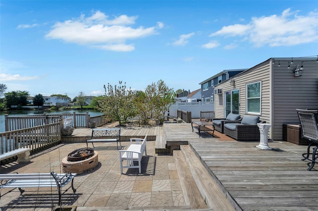 24 Raynor St, West Babylon, NY 11704 - deck with an outdoor living space with a fire pit, a water view, and a patio