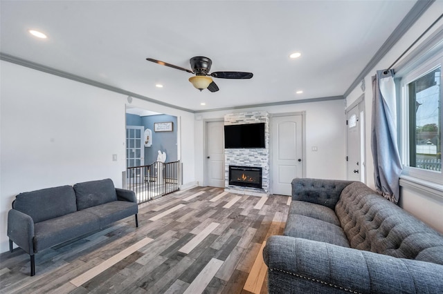 24 Raynor St, West Babylon, NY 11704 - living area featuring crown molding, wood finished floors, a ceiling fan, recessed lighting, and a fireplace