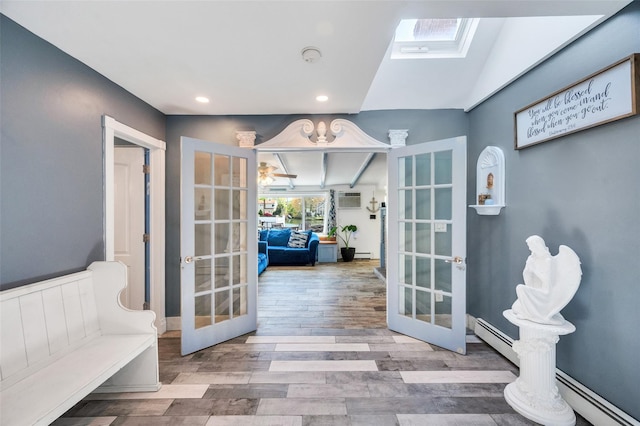 24 Raynor St, West Babylon, NY 11704 - sitting room with french doors, wood finished floors, a baseboard heating unit, recessed lighting, and lofted ceiling
