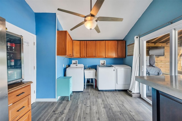 24 Raynor St, West Babylon, NY 11704 - laundry area with cabinet space, washer and clothes dryer, ceiling fan, and light wood-style flooring