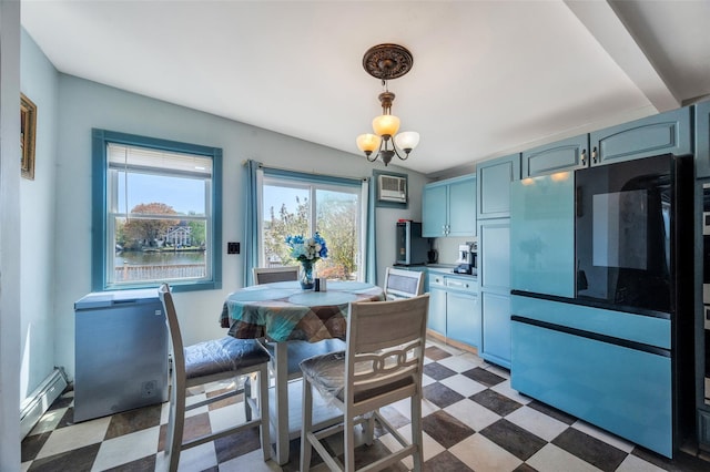 24 Raynor St, West Babylon, NY 11704 - dining room with light floors and a baseboard radiator