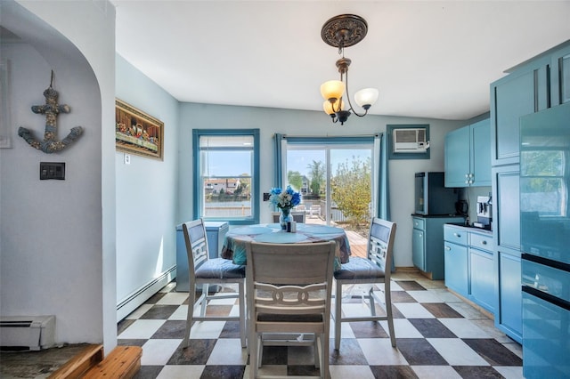 24 Raynor St, West Babylon, NY 11704 - dining room with a baseboard radiator, dark flooring, a wall mounted air conditioner, and baseboards