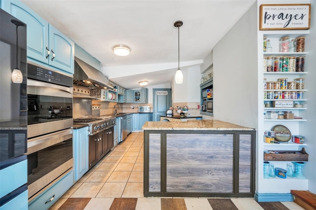 24 Raynor St, West Babylon, NY 11704 - kitchen featuring blue cabinetry, stainless steel appliances, wall chimney exhaust hood, decorative backsplash, and a sink